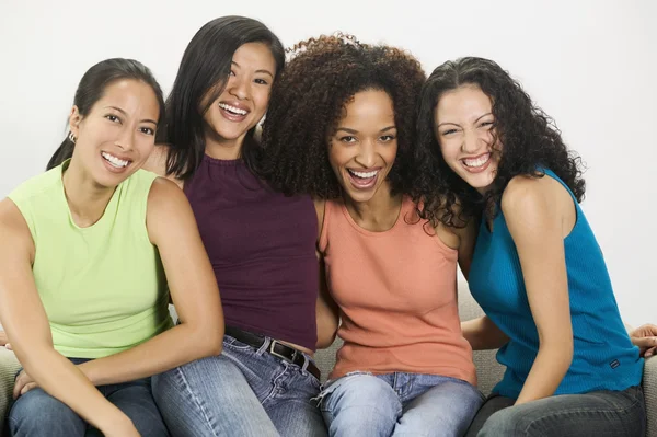 Group of young women looking at camera smiling