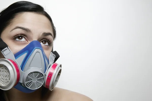 Hispanic woman wearing air filter mask