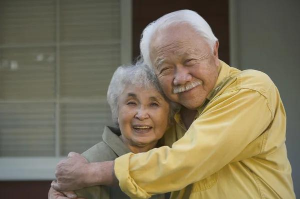 Senior couple hugging