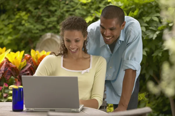 Couple looking at laptop together
