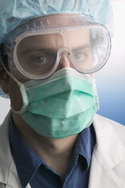 Portrait of scientist in goggles and face mask