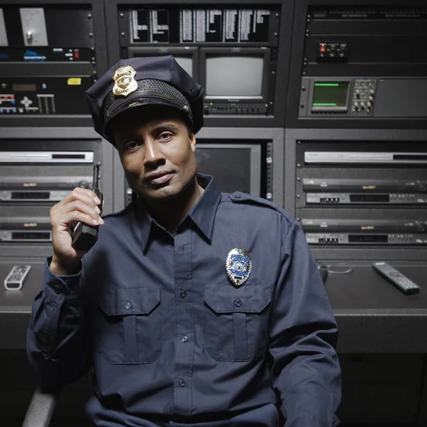 Security guard sitting at control station