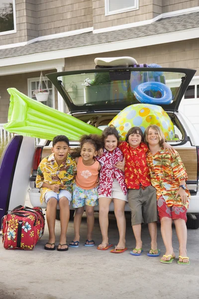 Children and beach gear in packed car
