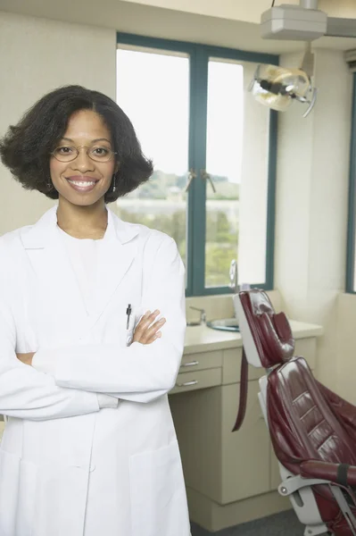 African female dentist smiling