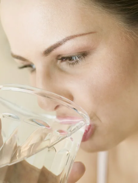 Hungarian woman drinking glass of water