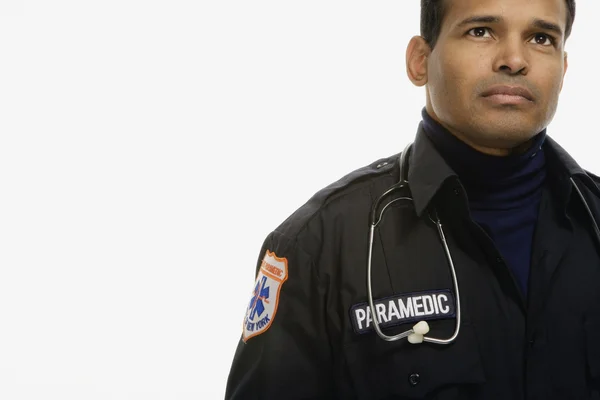 Studio shot of Hispanic male paramedic