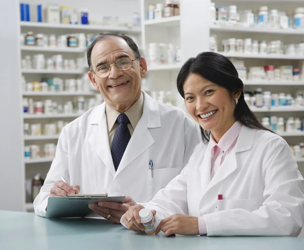 Two pharmacists in pharmacy