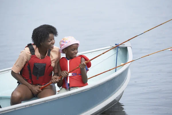 African mother and son fishing