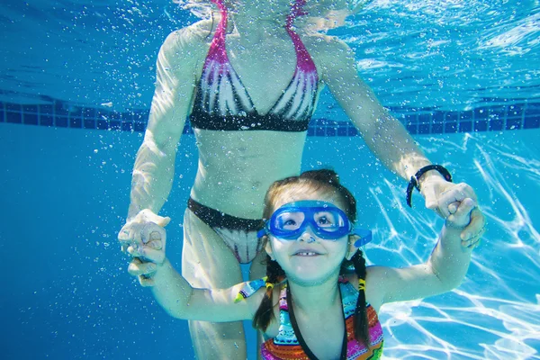 Underwater shot of Asian mother and daughter