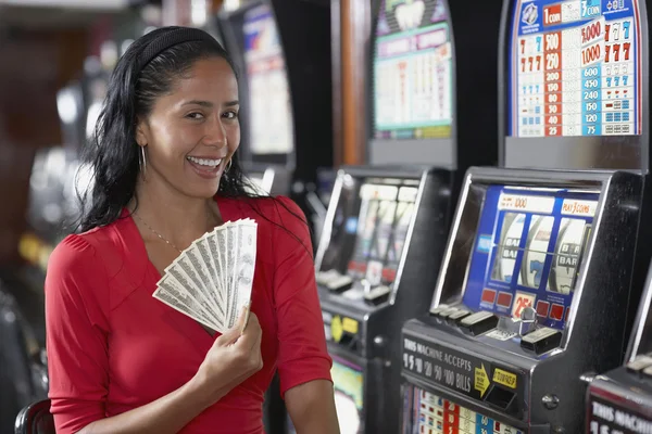 Hispanic woman holding money