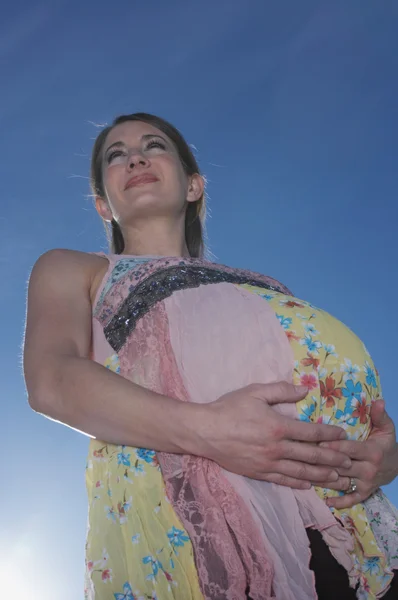 Low angle view of pregnant woman