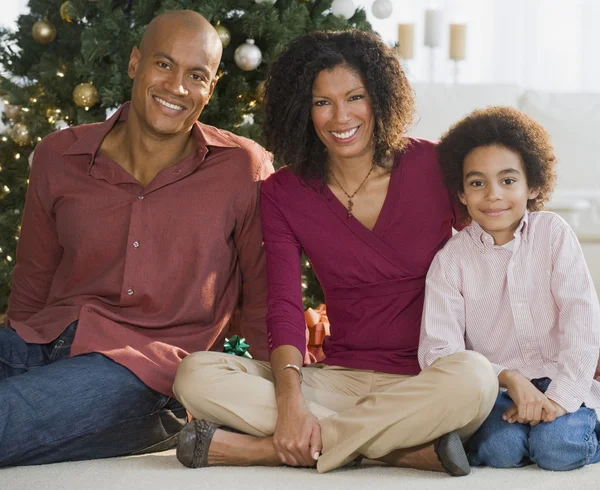 African family in front of Christmas tree