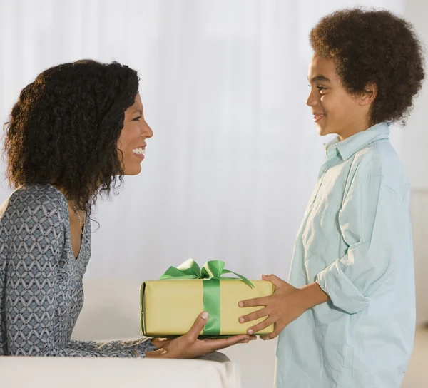 African mother and son exchanging gift