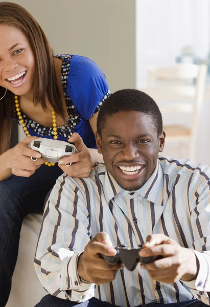 African couple playing video games — Stock Photo #23316306