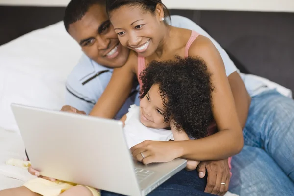African family looking at laptop