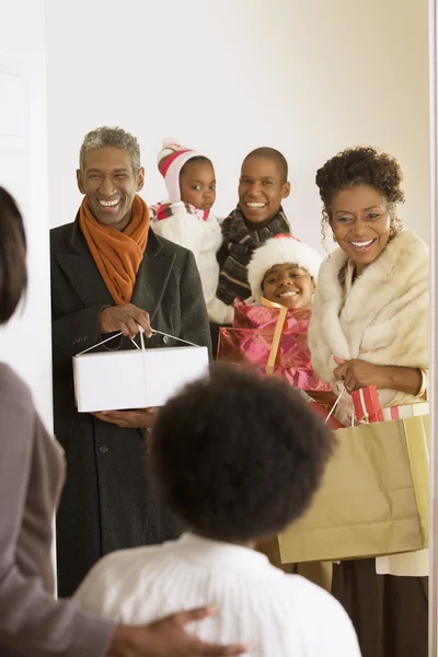 African family arriving with Christmas gifts
