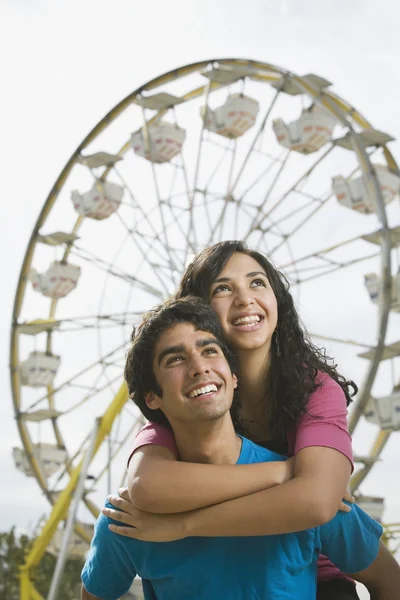 Multi-ethnic teenaged couple at carnival