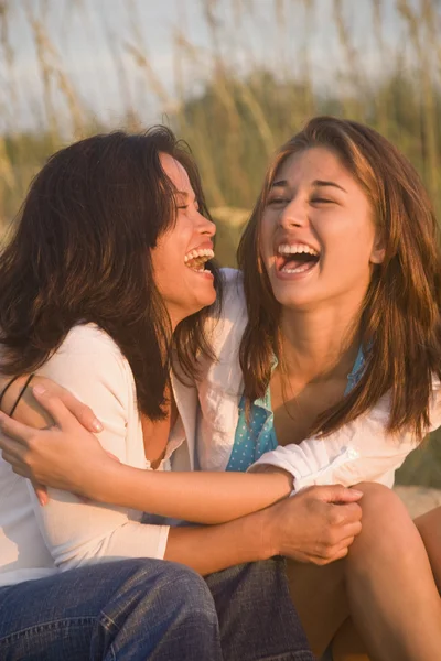 Asian mother and daughter laughing