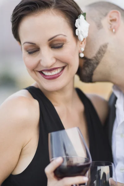 Cuban man kissing Cuban woman\'s neck