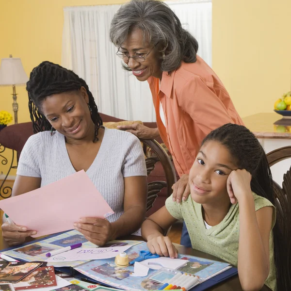 African family making scrapbook together