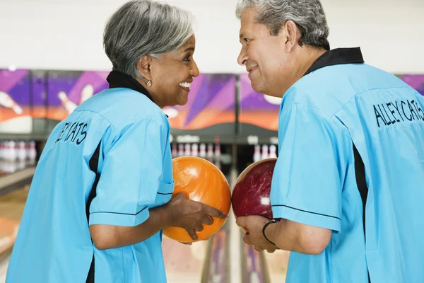 Two friends on bowling league about to bowl