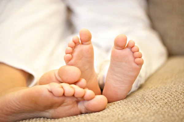 Mother s and baby s feet as a concept of motherhood or maternity