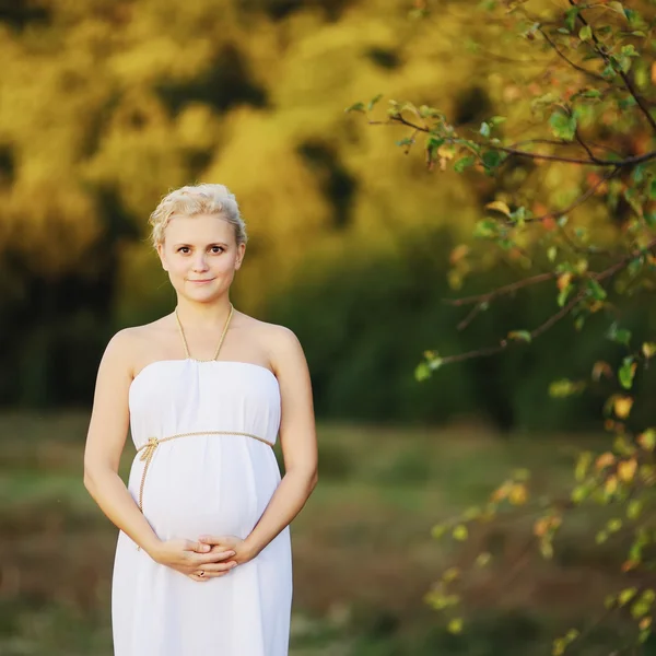 Pregnant woman outside