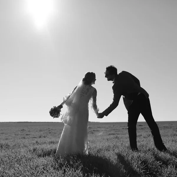 Black and white picture of happy wedding couple together.