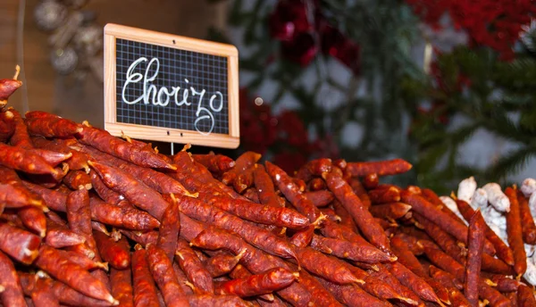 Traditional chorizo sausage at Christmas market. Paris.
