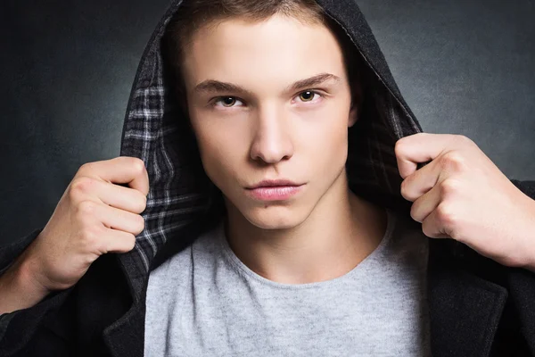 Handsome young fashionable guy with hoodie