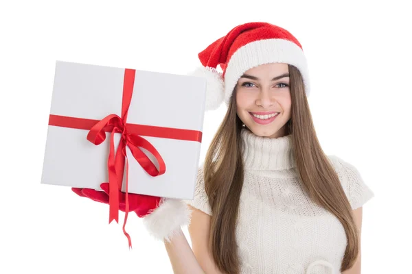快乐的十几岁女孩圣诞老人的帽子和大礼品盒 