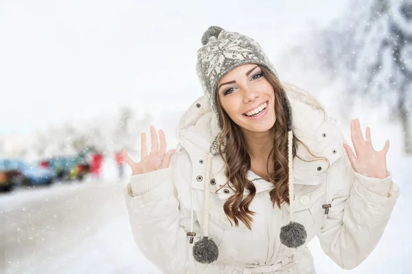 Happy teenage girl outdoors in winter