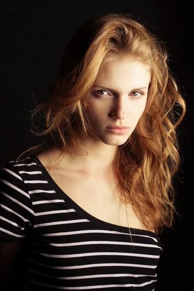 Portrait of a fashionable ginger model in t-shirt with black and