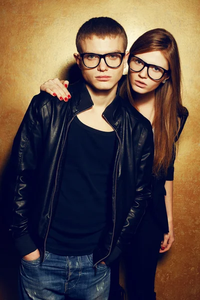 Portrait of gorgeous red-haired fashion twins in black clothes w