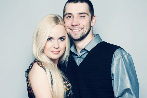 Portrait of happy and loving married couple posing together over