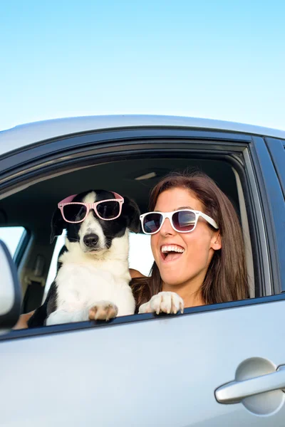Woman and dog fun in car