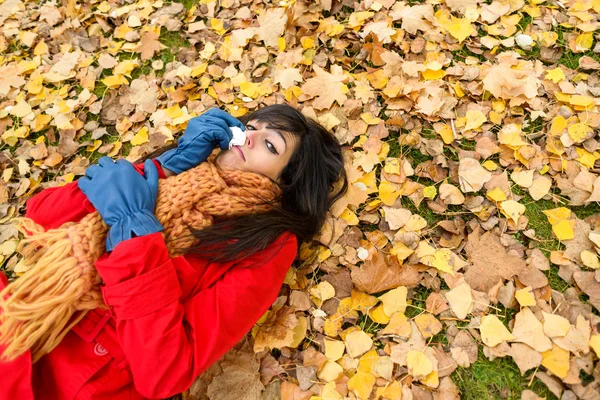 Sad depressed woman crying on autumn