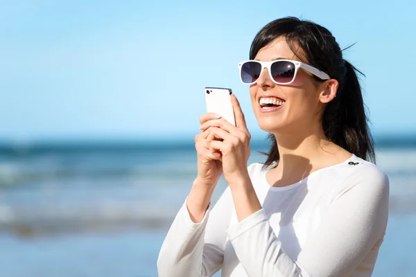 Woman typing message on cell phone