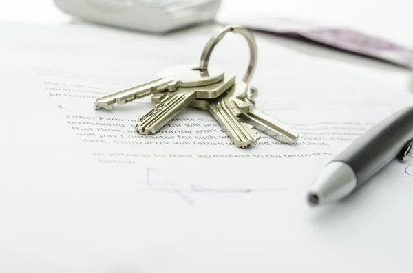 House keys on a contract of house sale