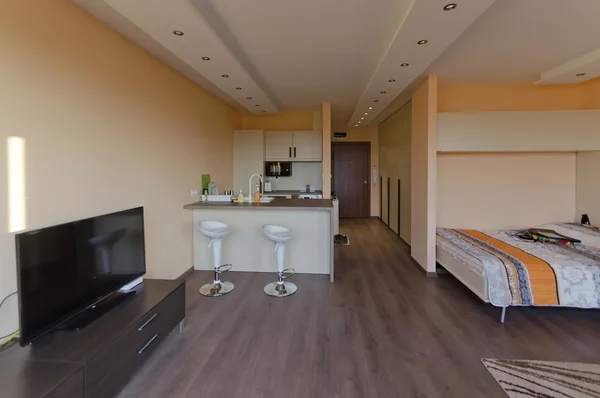 Modern living room with kitchen corner