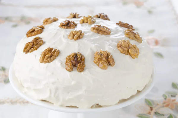 Coffee and walnut cake with whipped cream and caramelized walnut