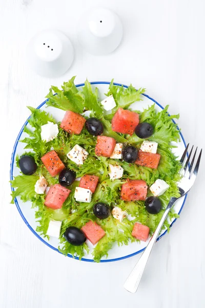 Fresh salad with watermelon, feta cheese and olives, vertical