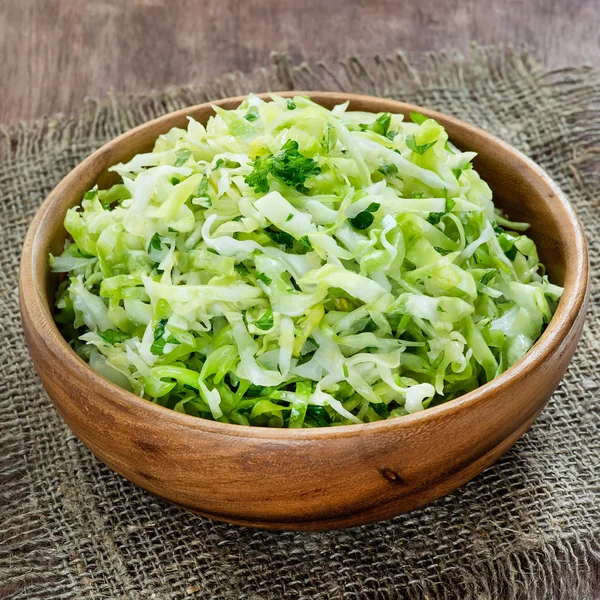 Cabbage salad in wooden bowl