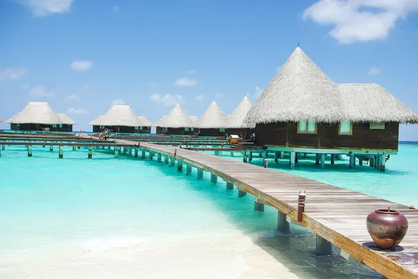 Water villas on tropical island on Maldives