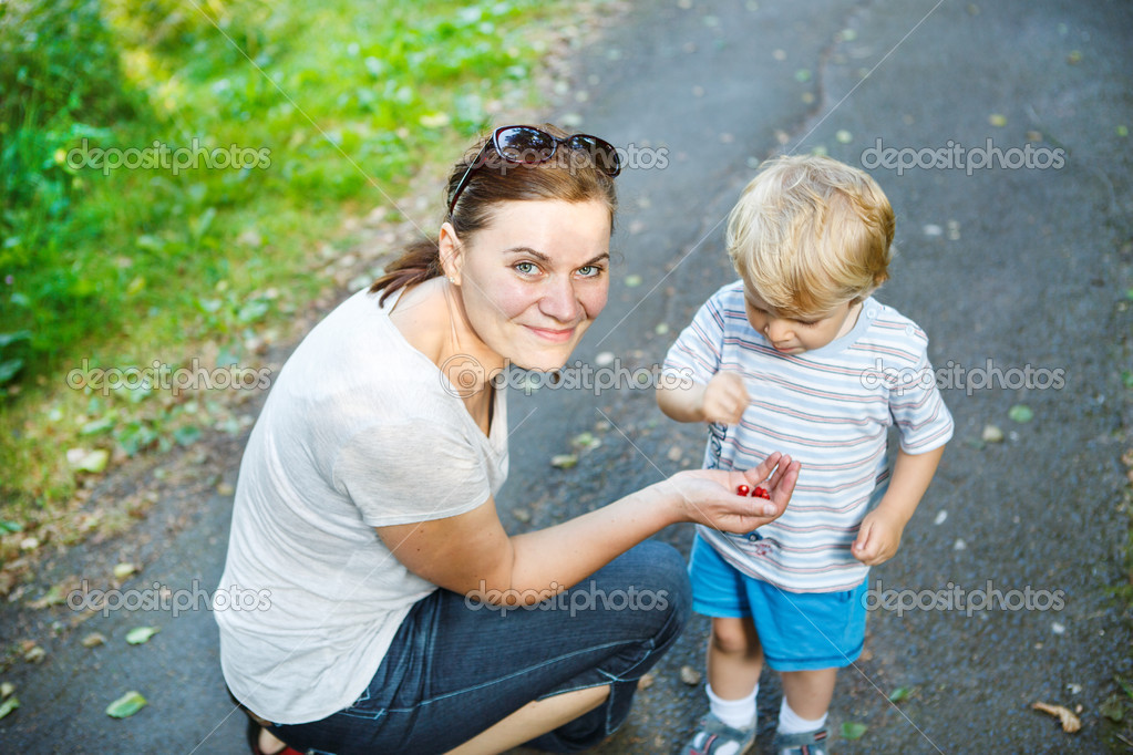 Google Images Mom And Little Boy | young mother and little toddler boy eating wild berries in Google Images Mom And Little Boy | young mother and little toddler boy eating wild berries in
