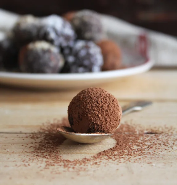 Assorted dark chocolate truffles with cocoa powder