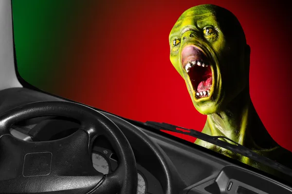 Screaming zombie and speedy car.