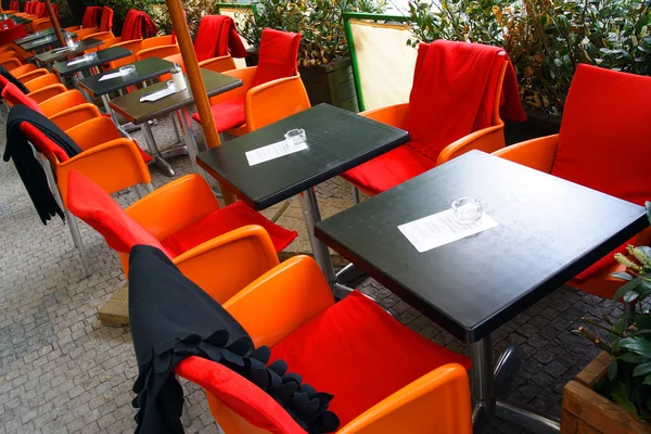 Tables and chairs in open air