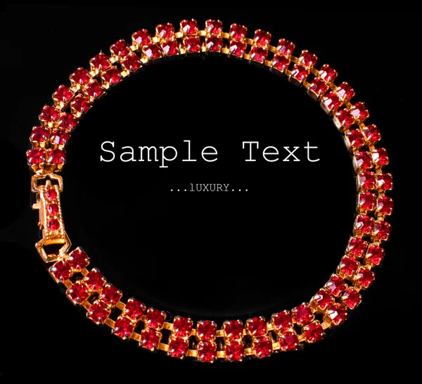 Golden necklace with red jewels