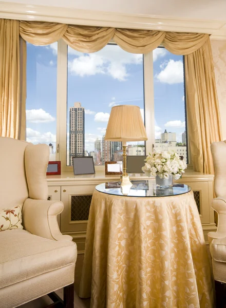 Sitting area in city apartment with skyline views